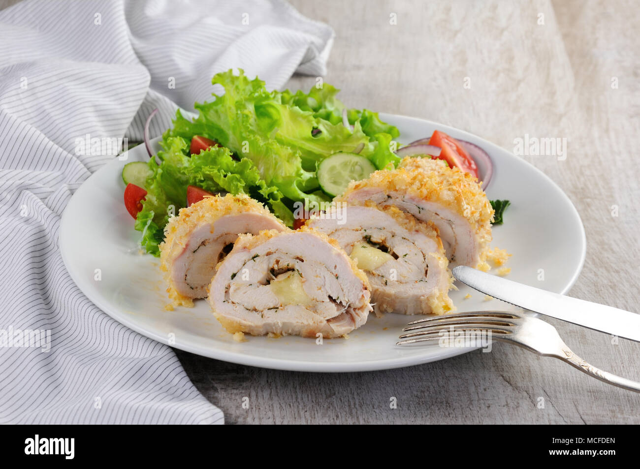 Sliced baked until golden, crispy crust chicken roll in breadcrumbs ...