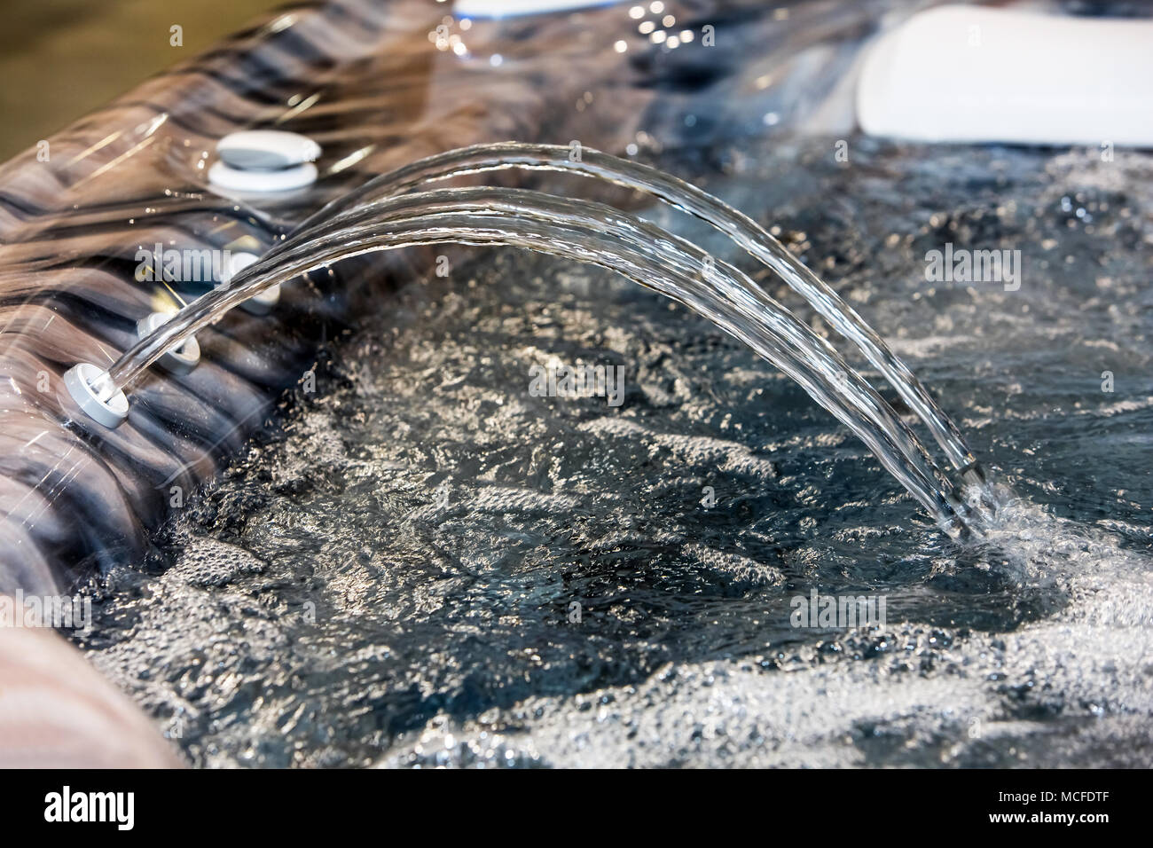 Jacuzzi jet of blue water with bubbles Stock Photo Alamy