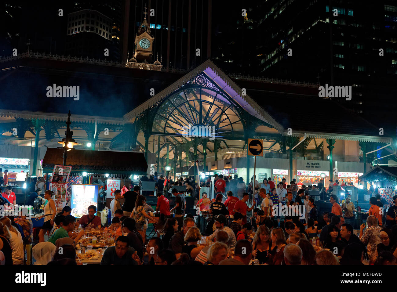 Diners, local, expat and tourist, at Lau Pa Sat, the Satay Club, in the Central Business District, Singapore Stock Photo