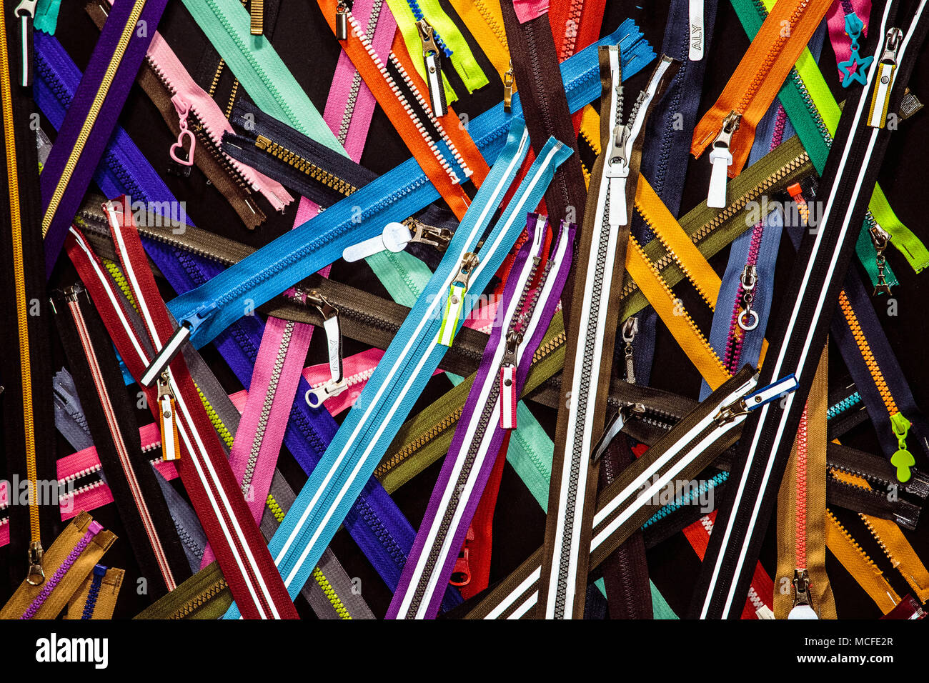 A lot of colorful zippers Stock Photo - Alamy