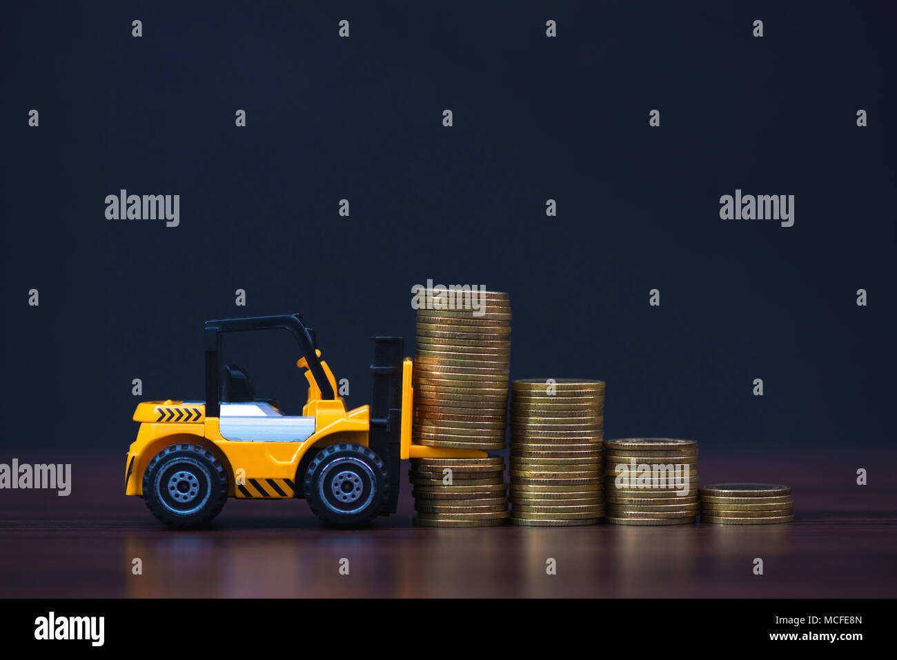Mini Forklift Truck Loading Stack Coin With Steps Of Gold Coin In Dark Business Finance And Banking Industrial Concept Idea Stock Photo Alamy