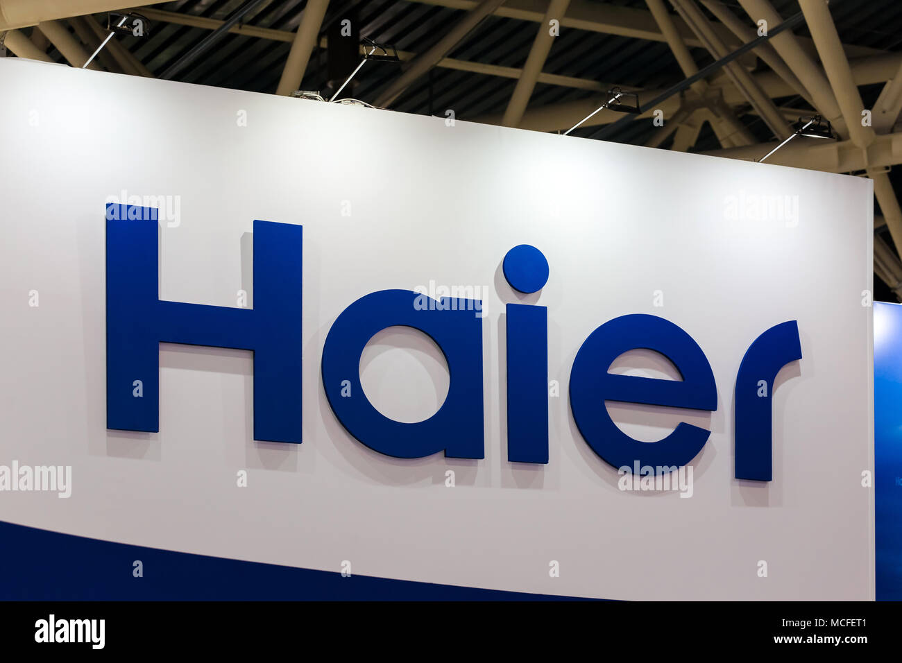 Haier logo company sign on the wall. Haier Group Corporation is a Chinese collective multinational consumer electronics and home appliances company Stock Photo