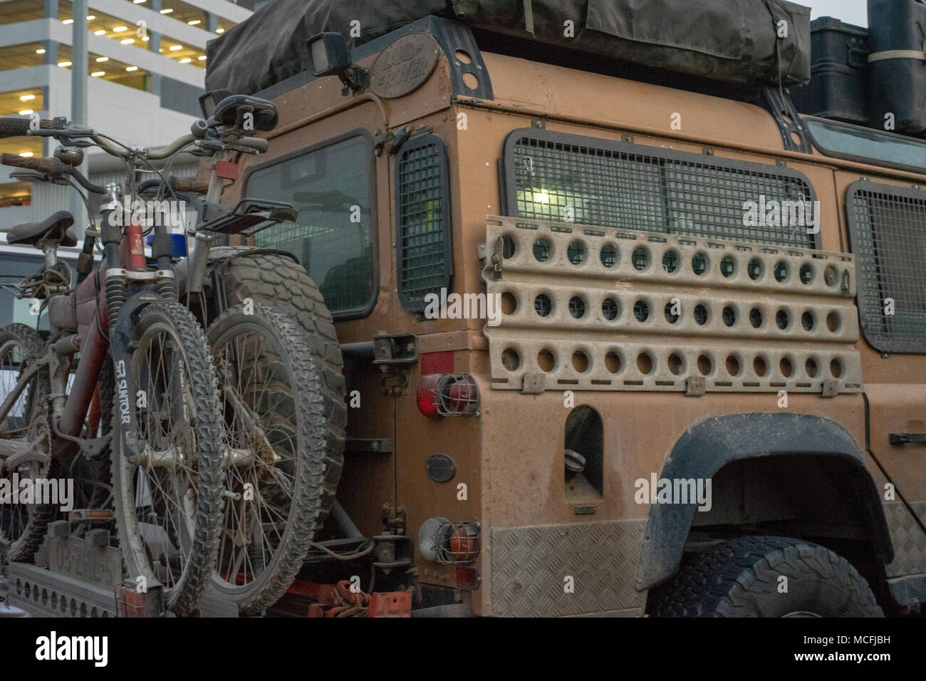 Couple of bicycles racked behind the Hummer Vehicle. Stock Photo