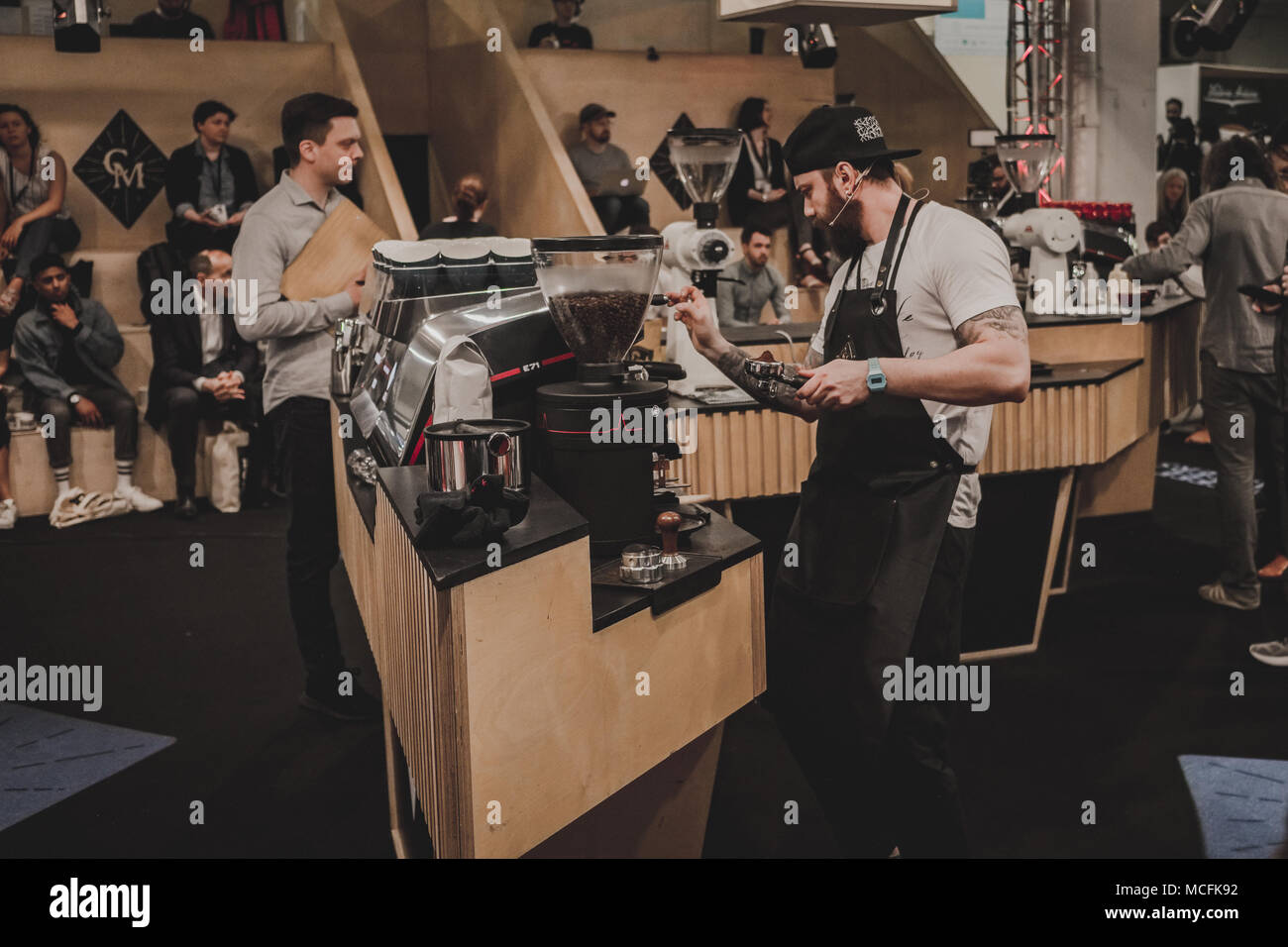 Man taking part in a coffee making competition at the London Coffee Festival – April 2018 Stock Photo