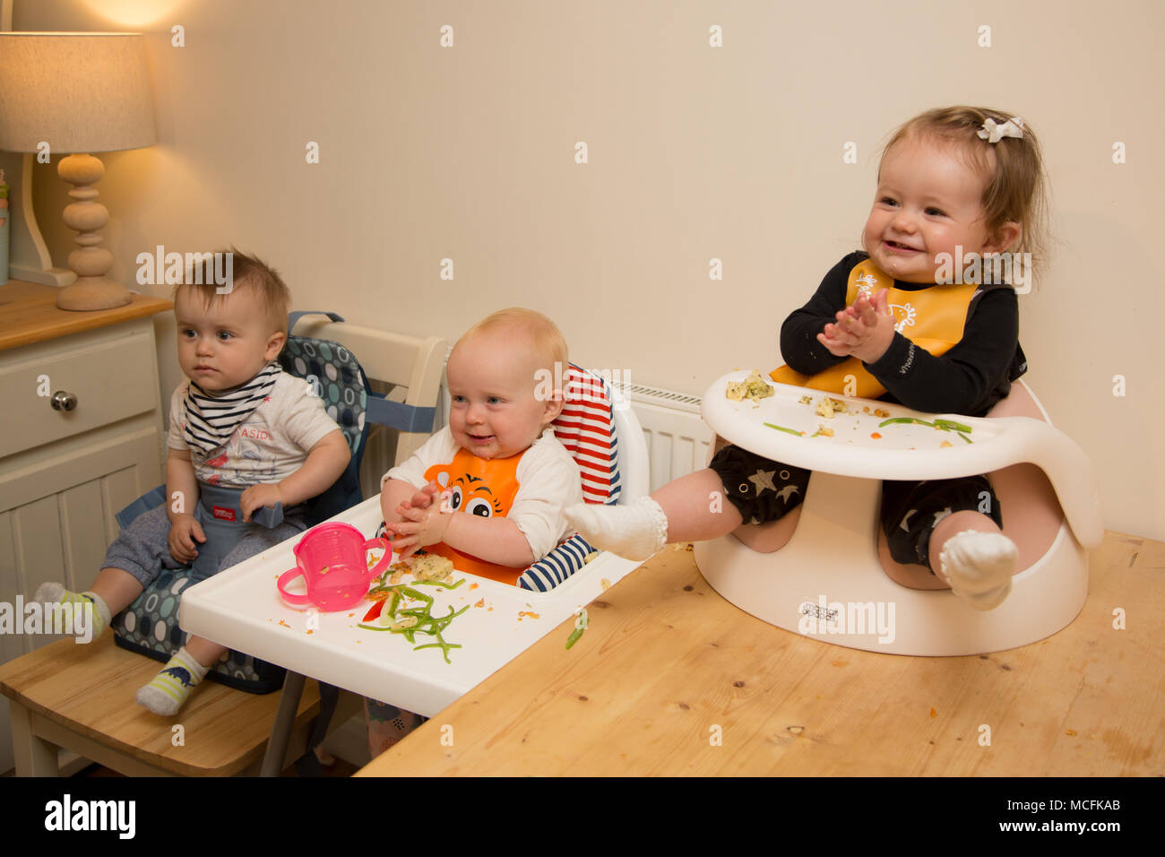 Babies and toddlers having a snack at nursery, UK Stock Photo Alamy