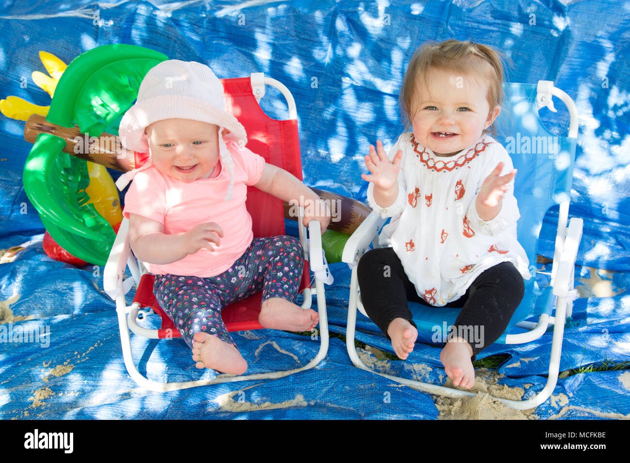 Toddlers playing with sand Stock Photo Alamy