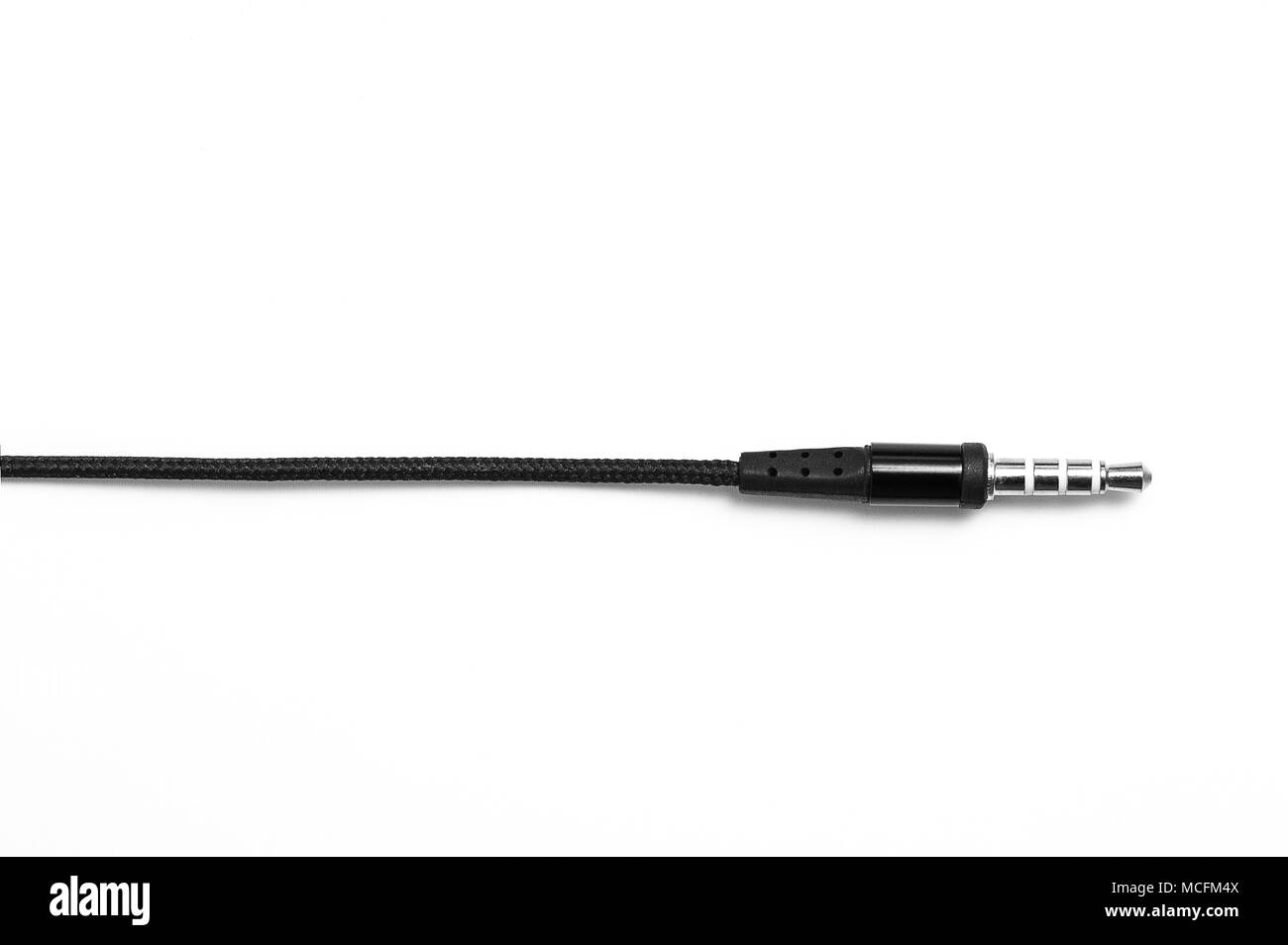 Black headphone audio cable in white background Stock Photo