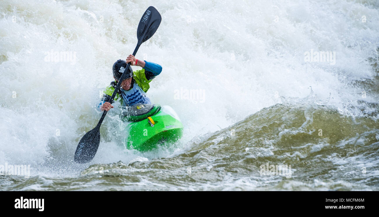 Skilled kayaker navigating a torrent of whitewater at Paddle South, the