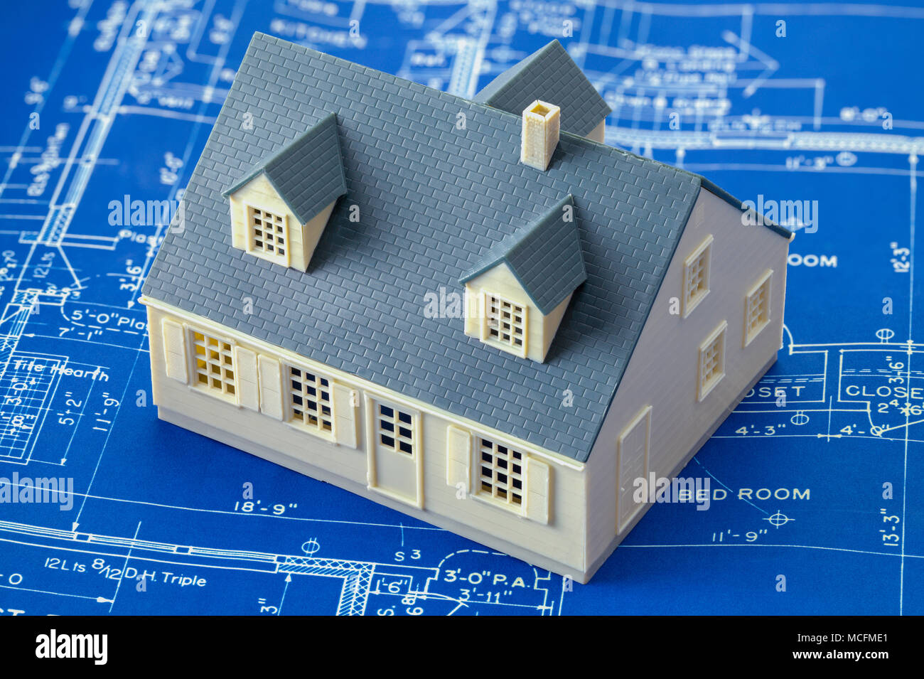 Paper Blue Prints and Small Model House. Stock Photo