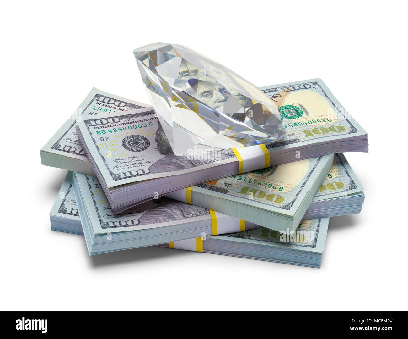 Pile of Money with a Large Diamond Isolated on a White Background. Stock Photo