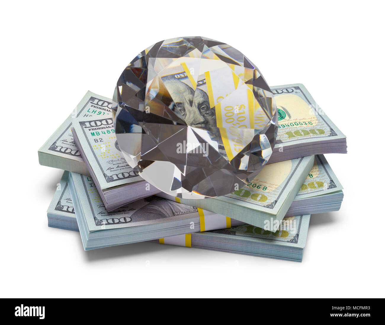 Pile of Money with a Large Diamond Isolated on a White Background. Stock Photo