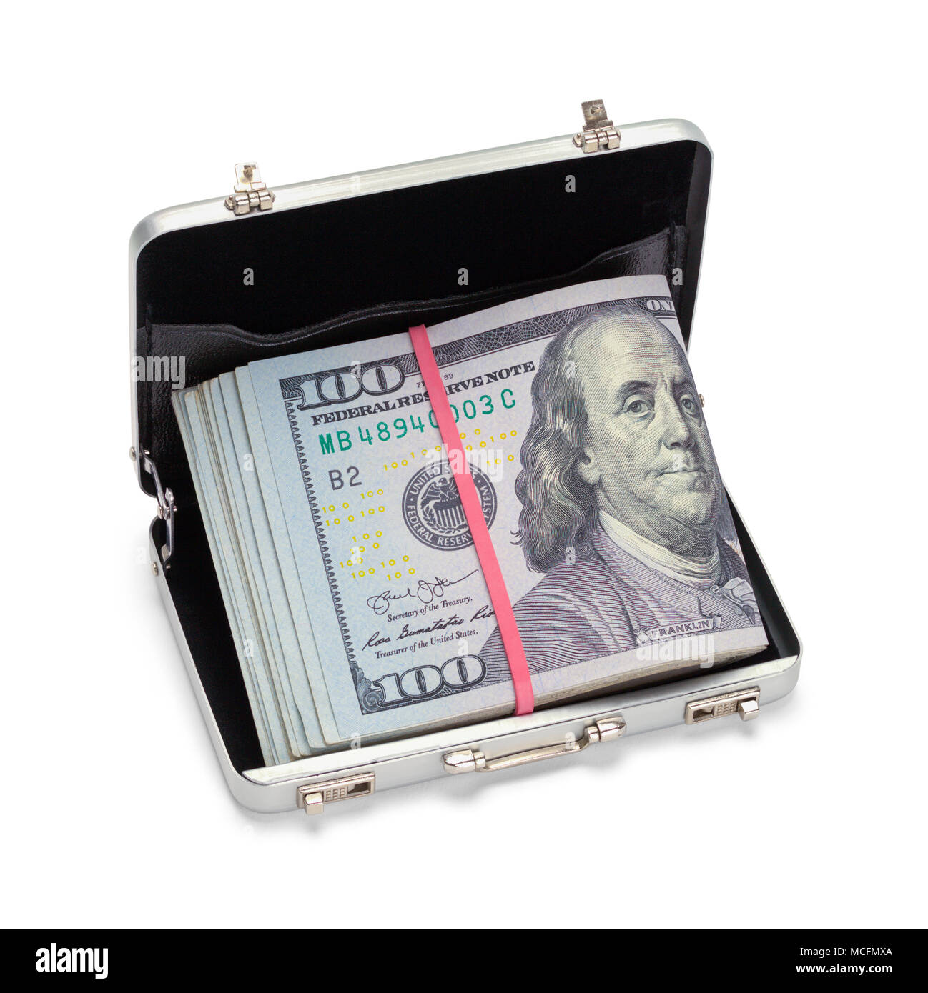 Small Breifcase Full of Money Isolated on a White Background. Stock Photo