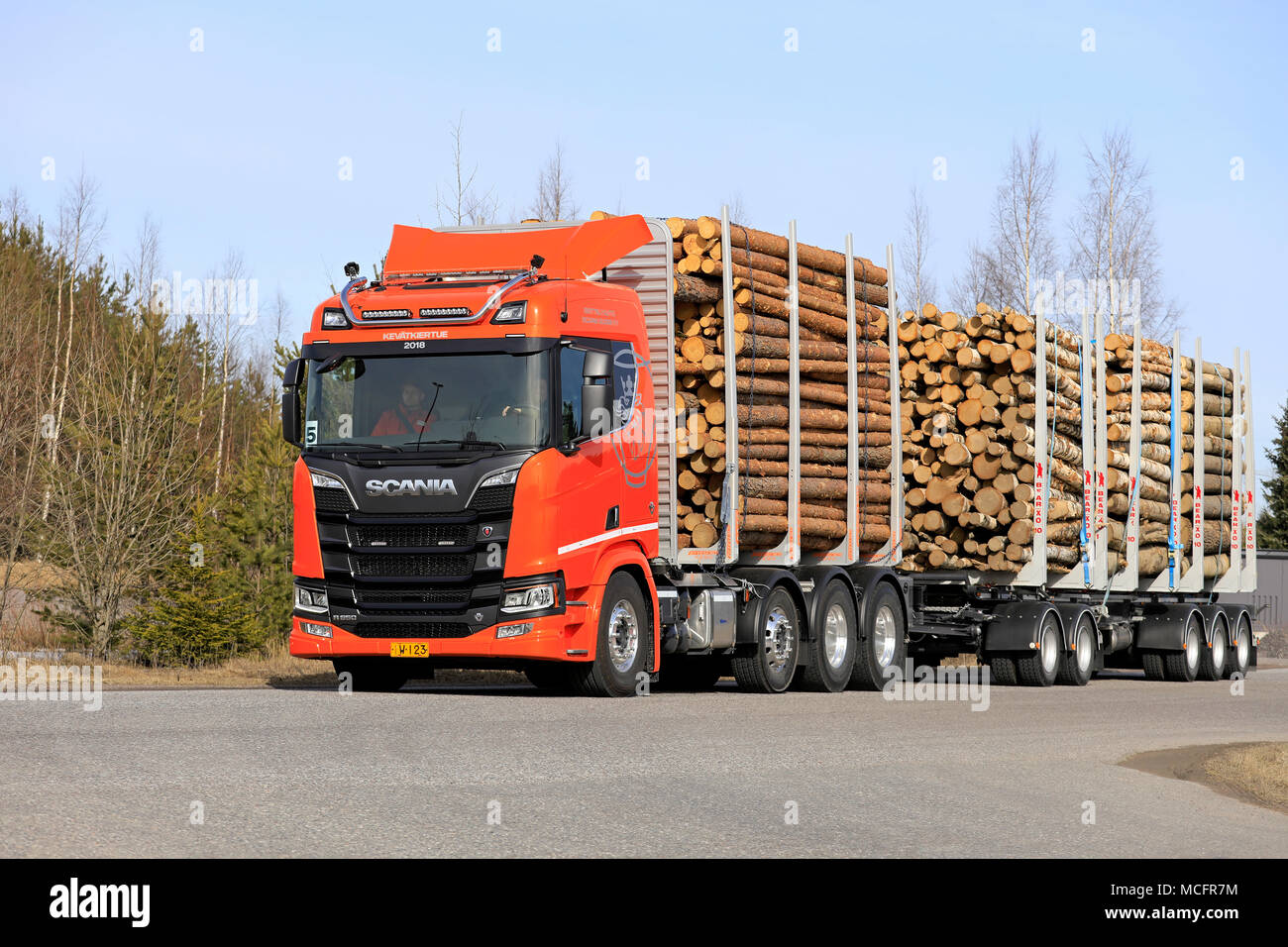 LIETO, FINLAND - APRIL 12, 2018: Orange Scania R650 logging truck on test drive on Scania Tour 2018 in Turku. Stock Photo