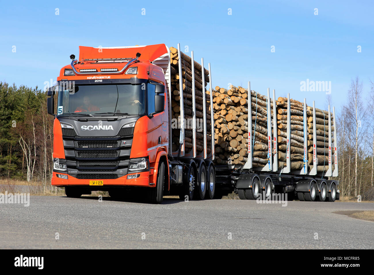 LIETO, FINLAND - APRIL 12, 2018: Orange Scania R650 logging truck on test drive on Scania Tour 2018 in Turku. Stock Photo