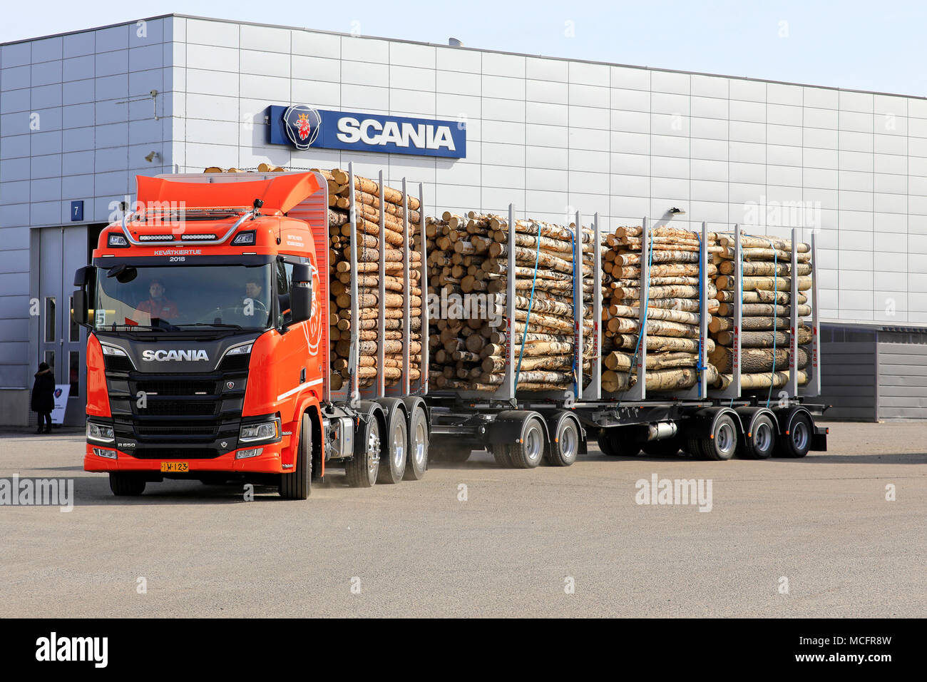 LIETO, FINLAND - APRIL 12, 2018: Orange Scania R650 logging truck at Scania dealer for test drive during Scania Tour 2018 in Turku. Stock Photo