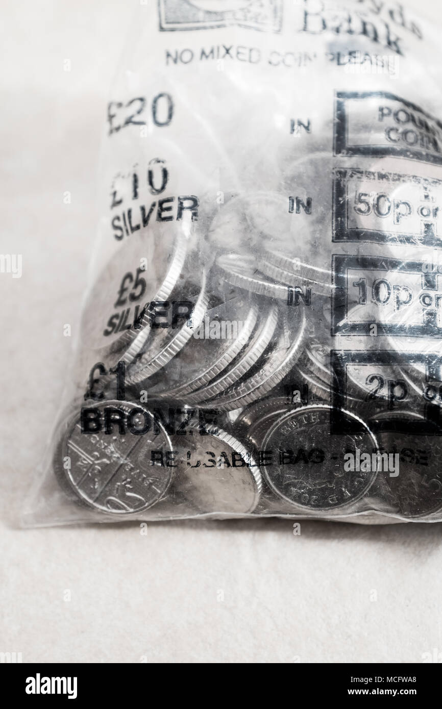 British Five Pence And Ten Pence Coins In A Plastic Bank Bag Stock - british five pence and ten pence coins in a plastic bank bag