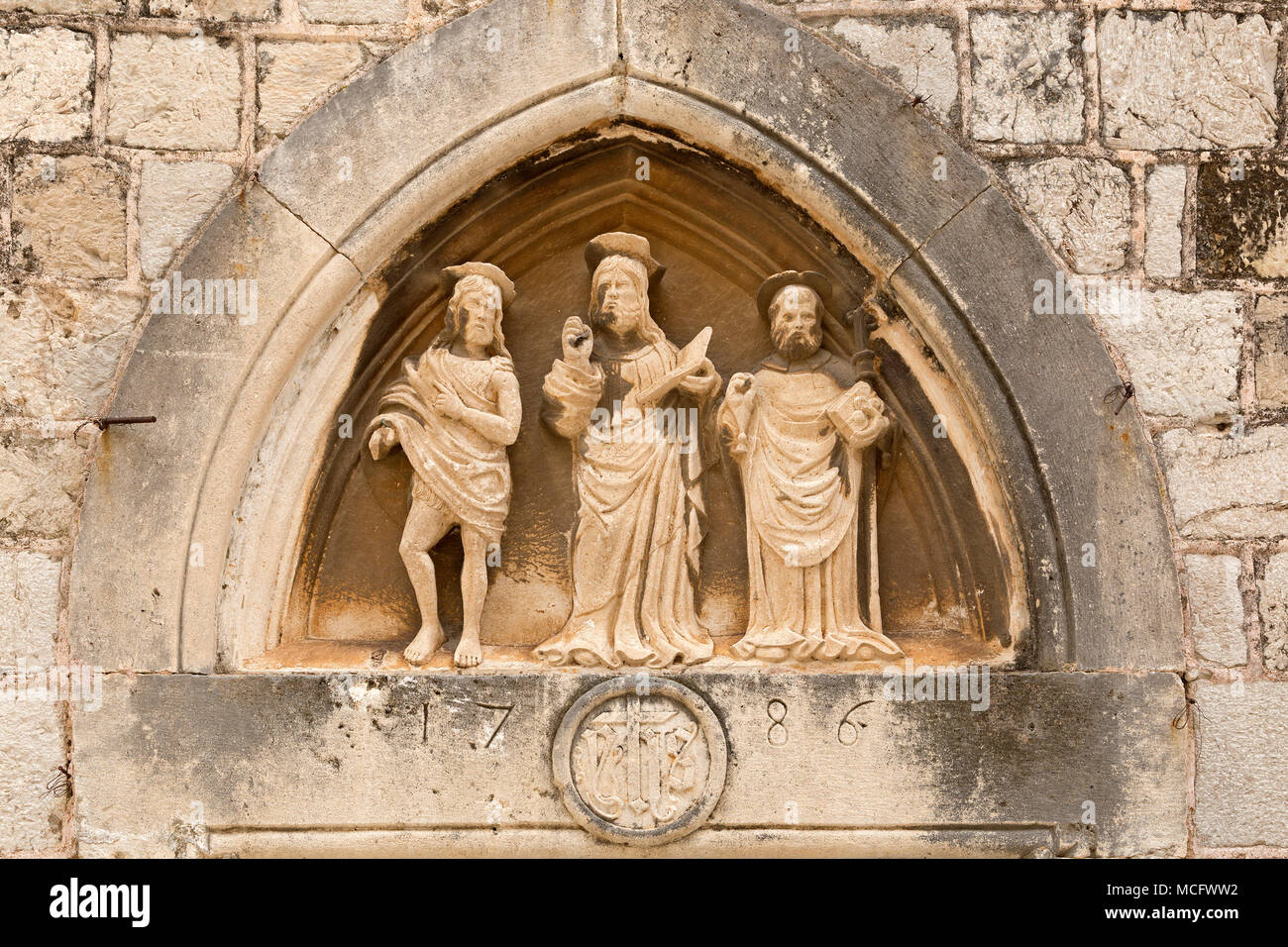 carving above entrance to Church of St. Luke, old town, Dubrovnik, Croatia Stock Photo