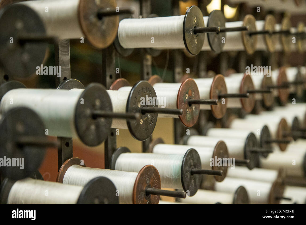 Spools of yarn on display at  at the Paterson Museum in Paterson, NJ Stock Photo