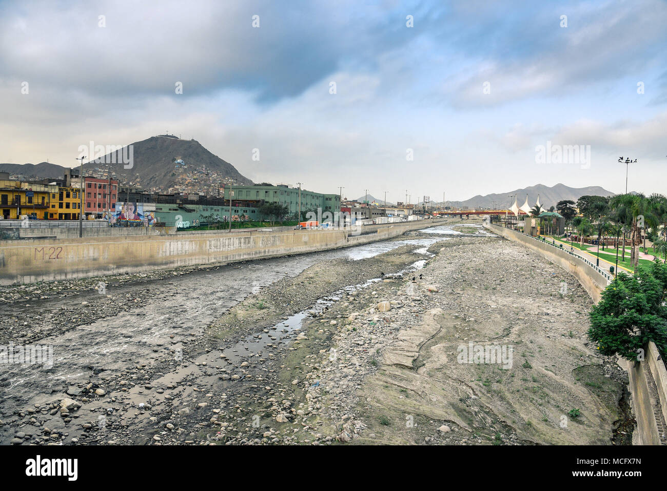 Lima / Peru - 07.18.2017: Dry and dirty bottom of the Rimac river in downtown. Stock Photo