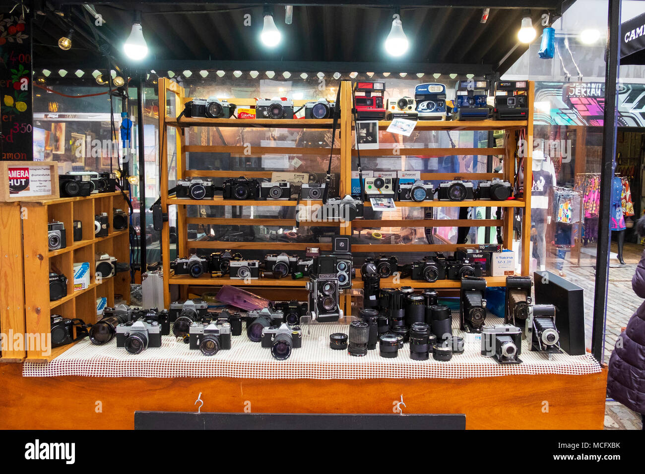 Film cameras and lenses for sale at a stall in Camden Lock Place