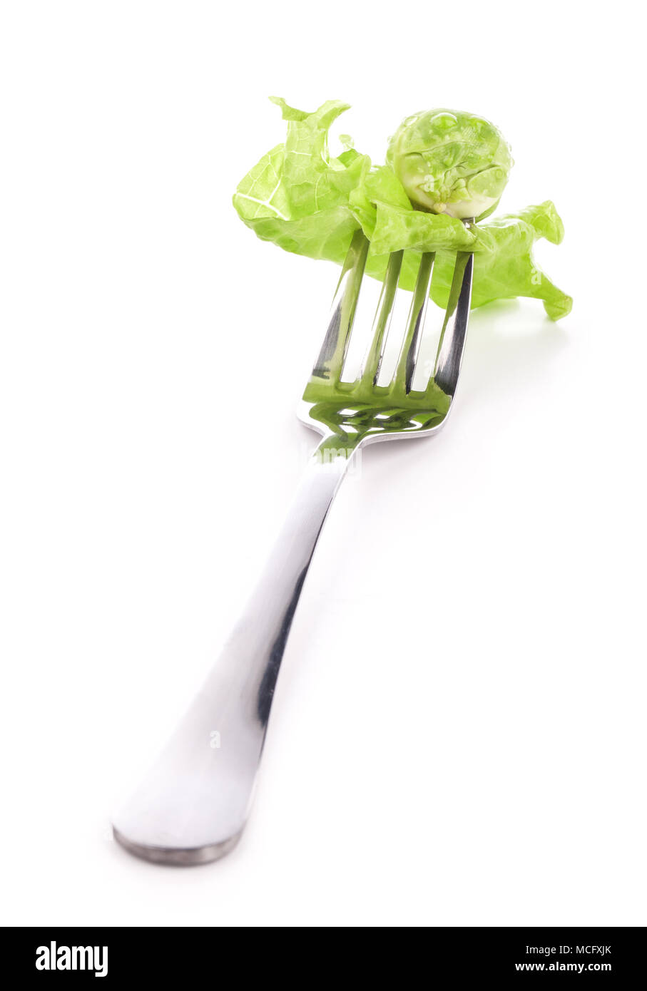 Salad on fork isolated on white background Stock Photo Alamy