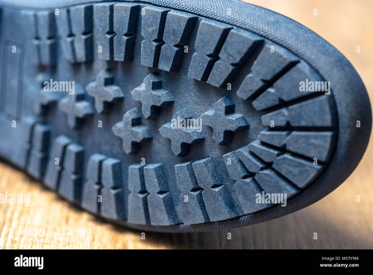 close up of the bottom of a pair of shoes showing the tread pattern. Stock Photo