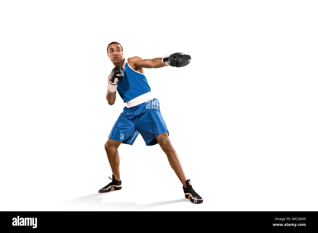 Sporty man during boxing exercise. Photo of boxer on white background