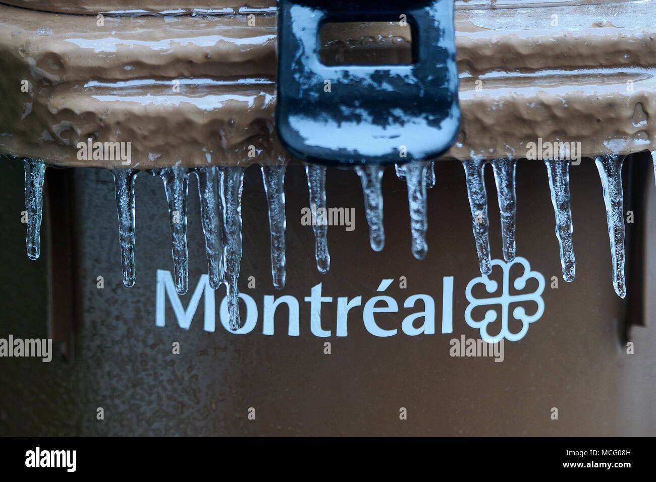 Montreal,Canada,16,April,2018.Recycling bin covered with ice and sleet