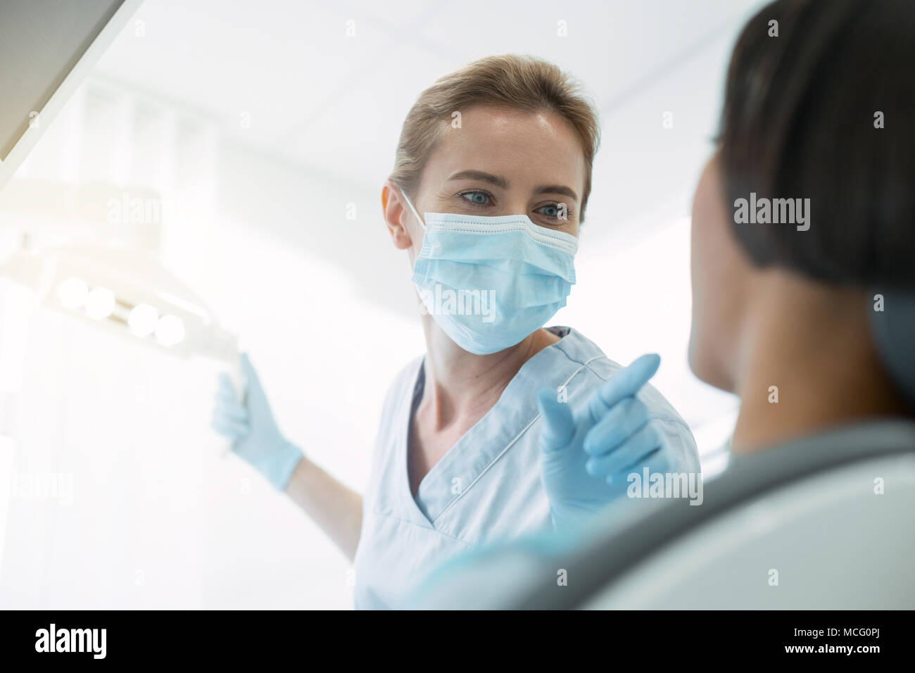 Experienced dentist pointing at a bad tooth Stock Photo Alamy