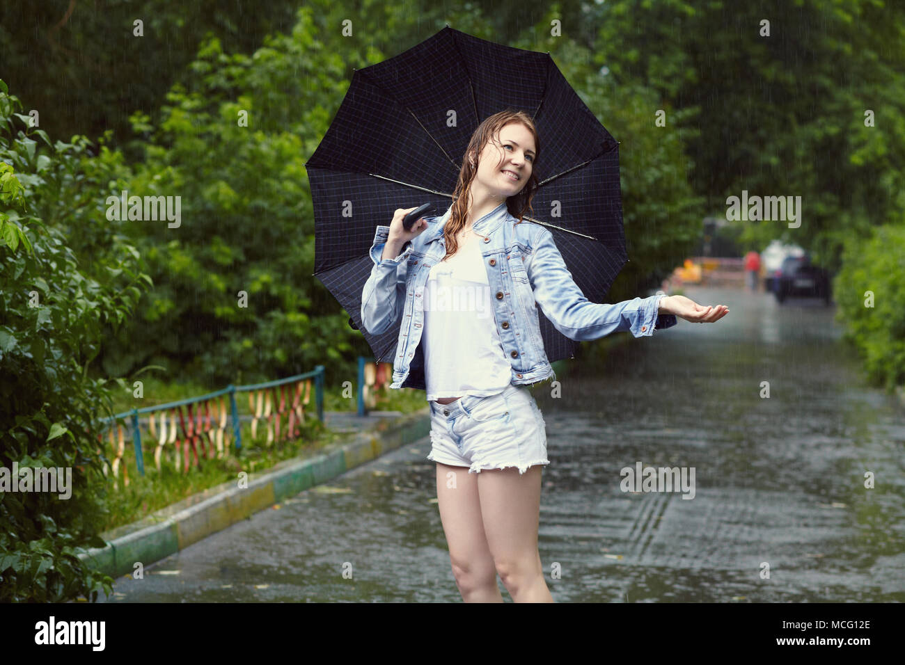 girl walking in the rain Stock Photo Alamy