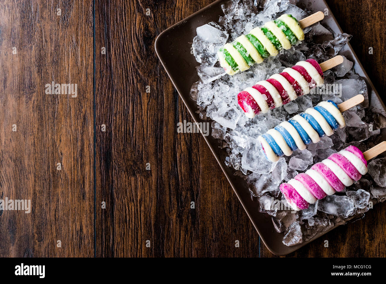 Popsicles ice cream with ice on dark surface. Summer Dessert Concept Stock Photo Alamy