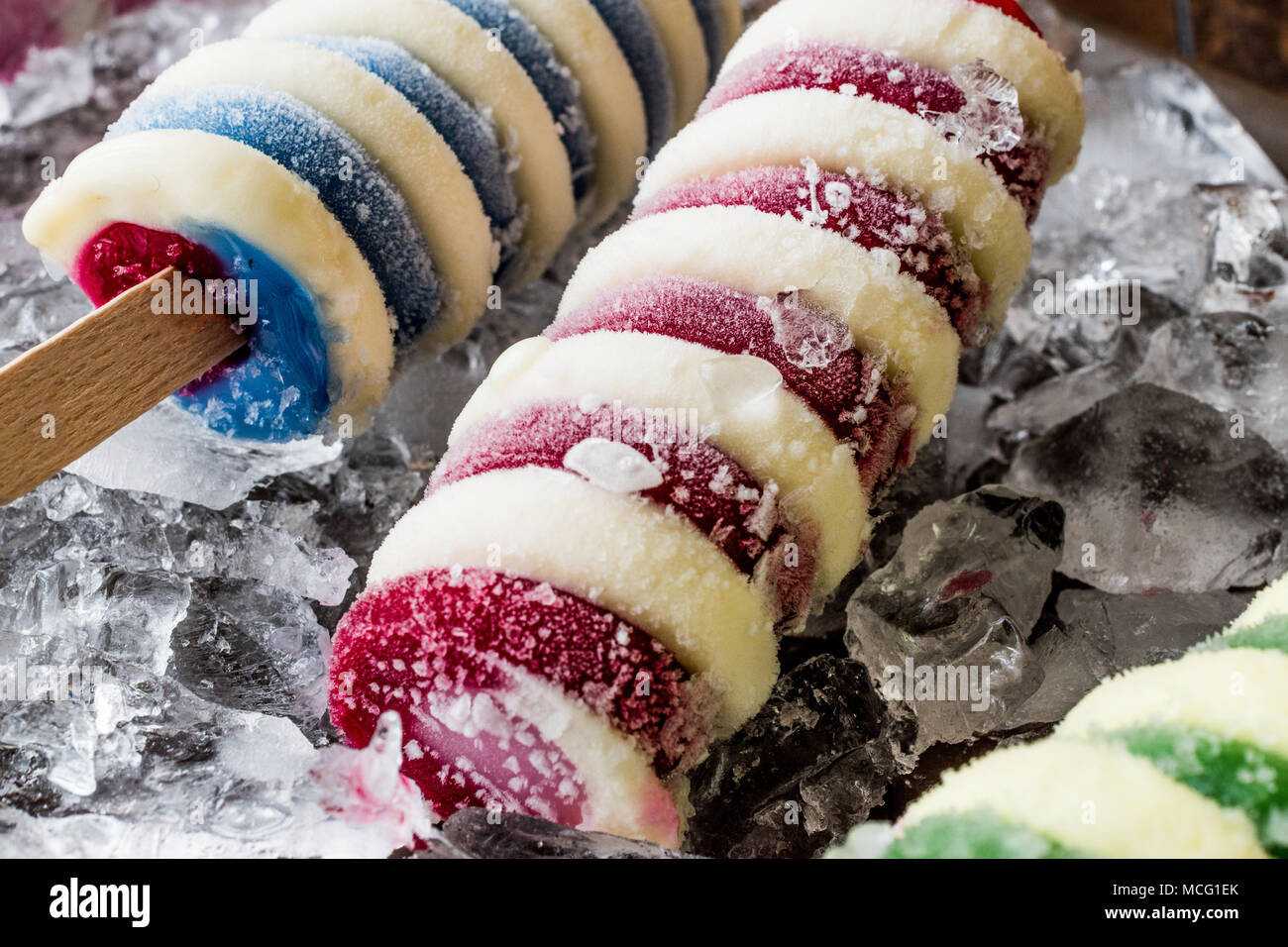 Popsicles ice cream with ice on dark surface. Summer Dessert Concept