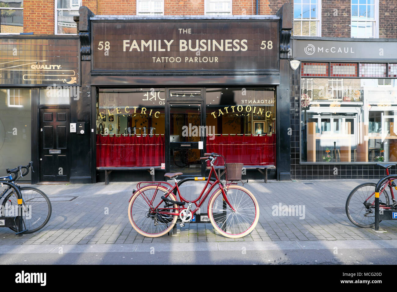 The Family Business Tattoo Parlour shop exterior in a traditional row of shops in Exmouth Market Clerkenwell, London EC1 England UK  KATHY DEWITT Stock Photo