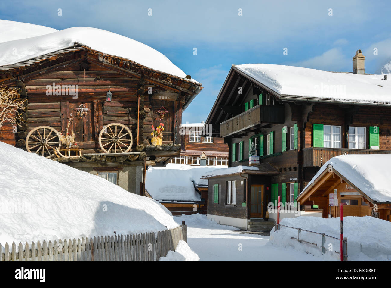 Main street with historical wooden houses in village of Murren in