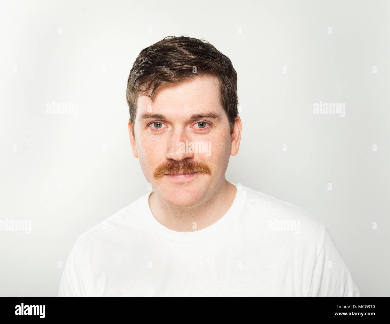 A smirking man and his moustache. Stock Photo