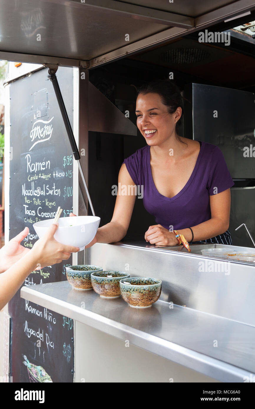 Adria Montaño Chef Serving Food From Her Food Truck Don