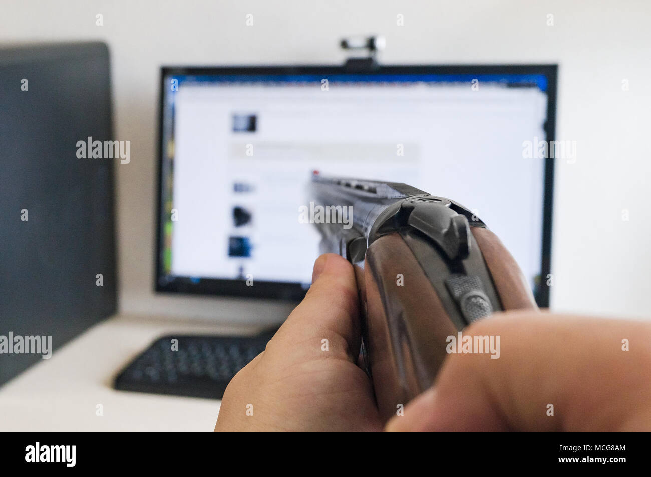 Hatred of the computer and modern technologies and aming a hunting or sporting classic smoothbore gun Stock Photo