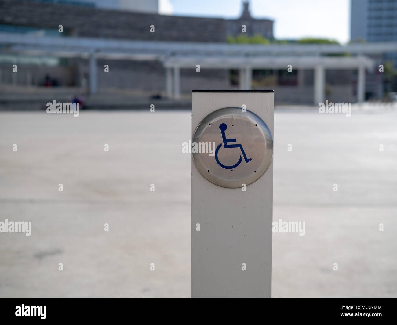 Handicap Accessibility Door Button On A Post Outside Of A Building
