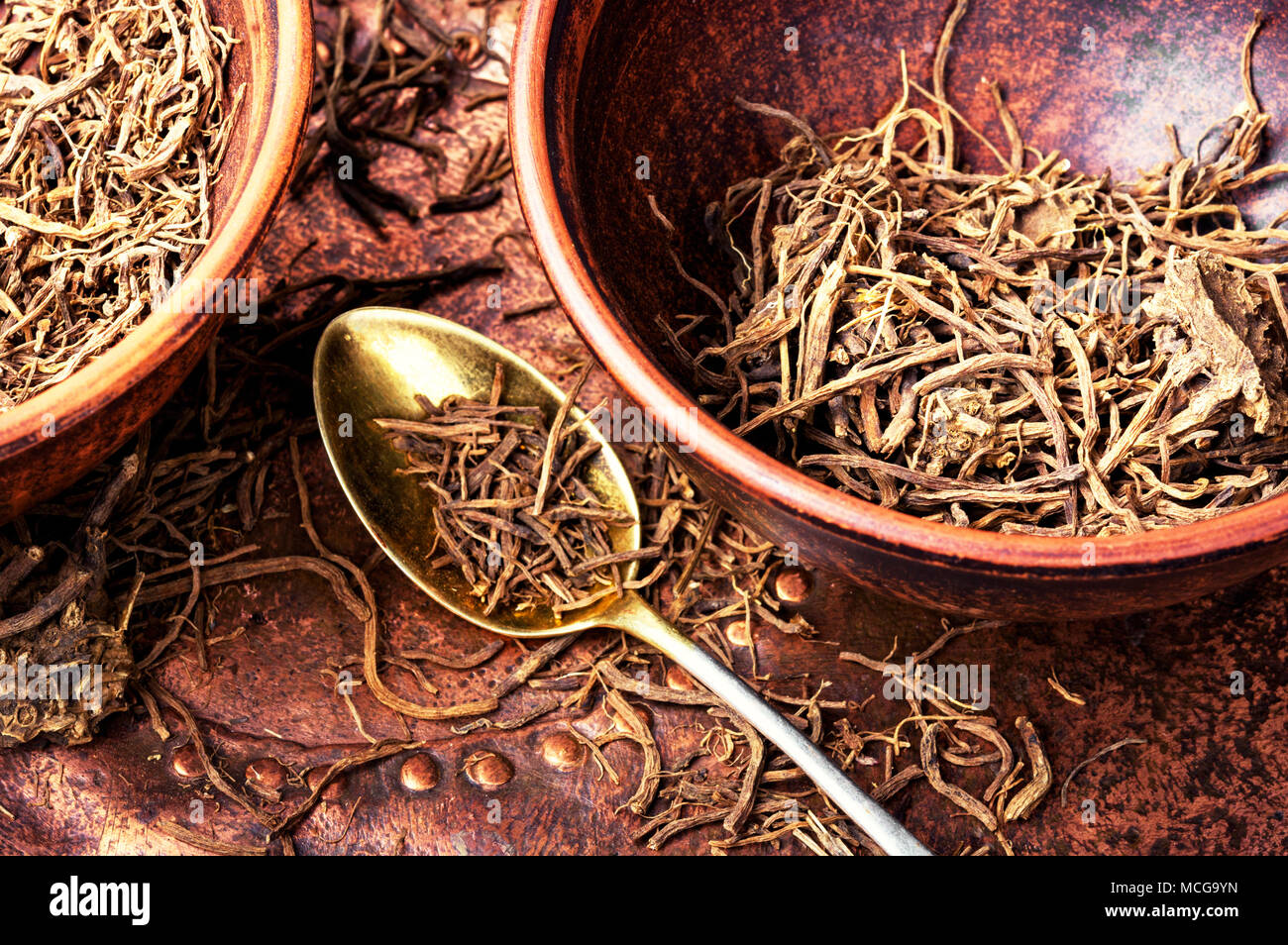 Traditional remedy from valerian roots in a mortar.Herbal medicine