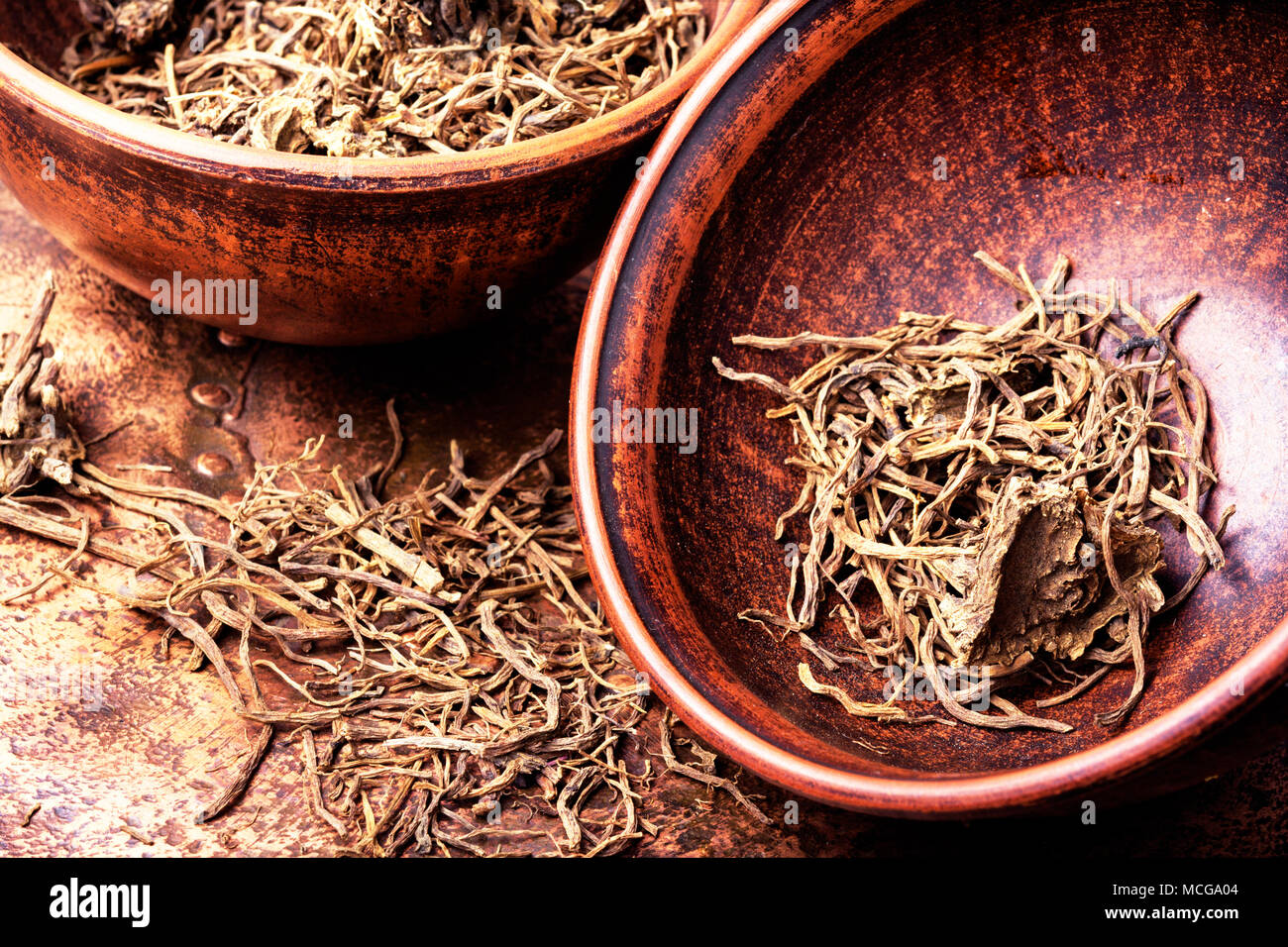 Traditional remedy from valerian roots in a mortar.Herbal medicine