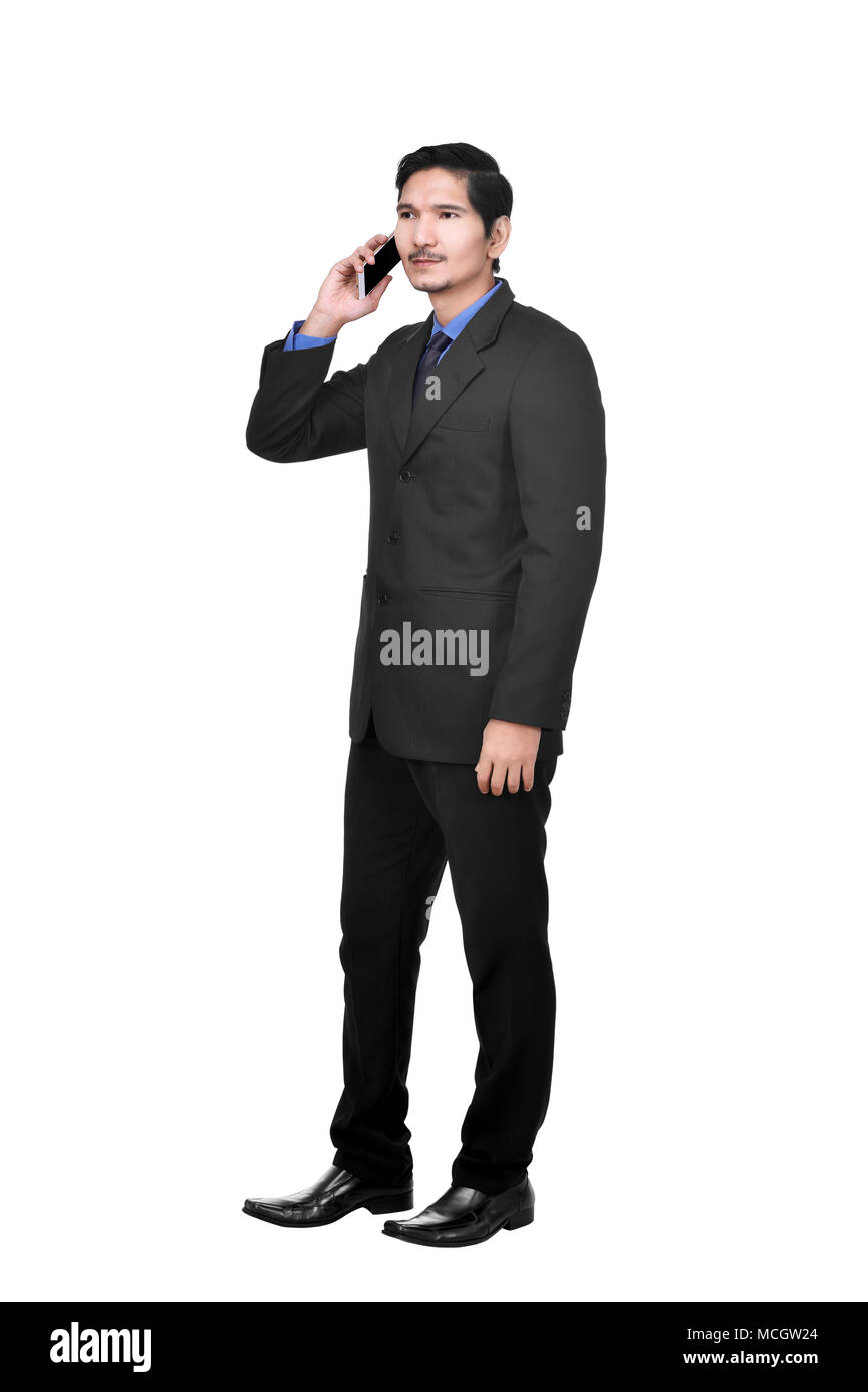 Portrait of asian businessman talking on the cellphone posing isolated over white background Stock Photo