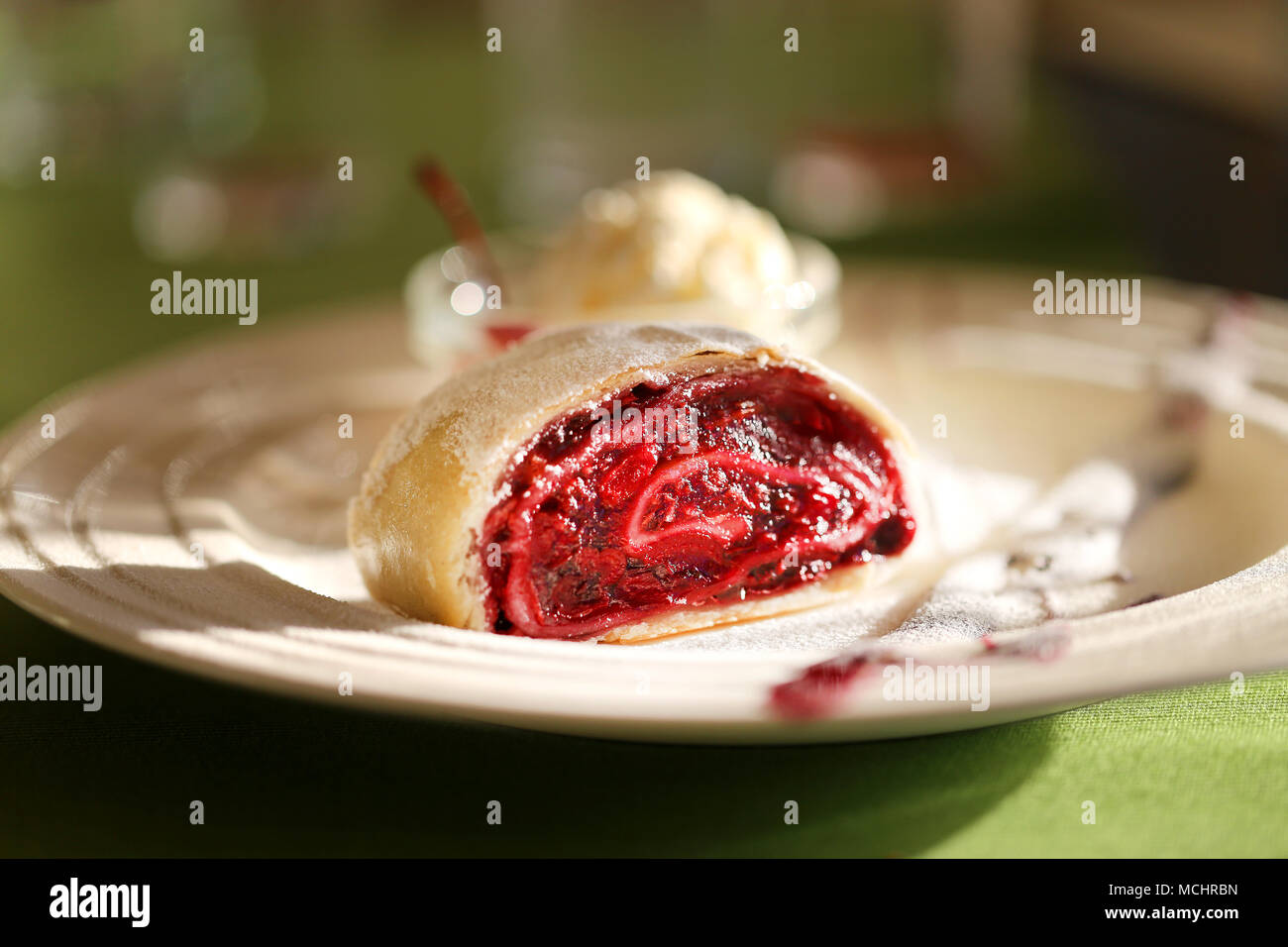 Photo of a macro of delicious bright strudel with cherry Stock Photo