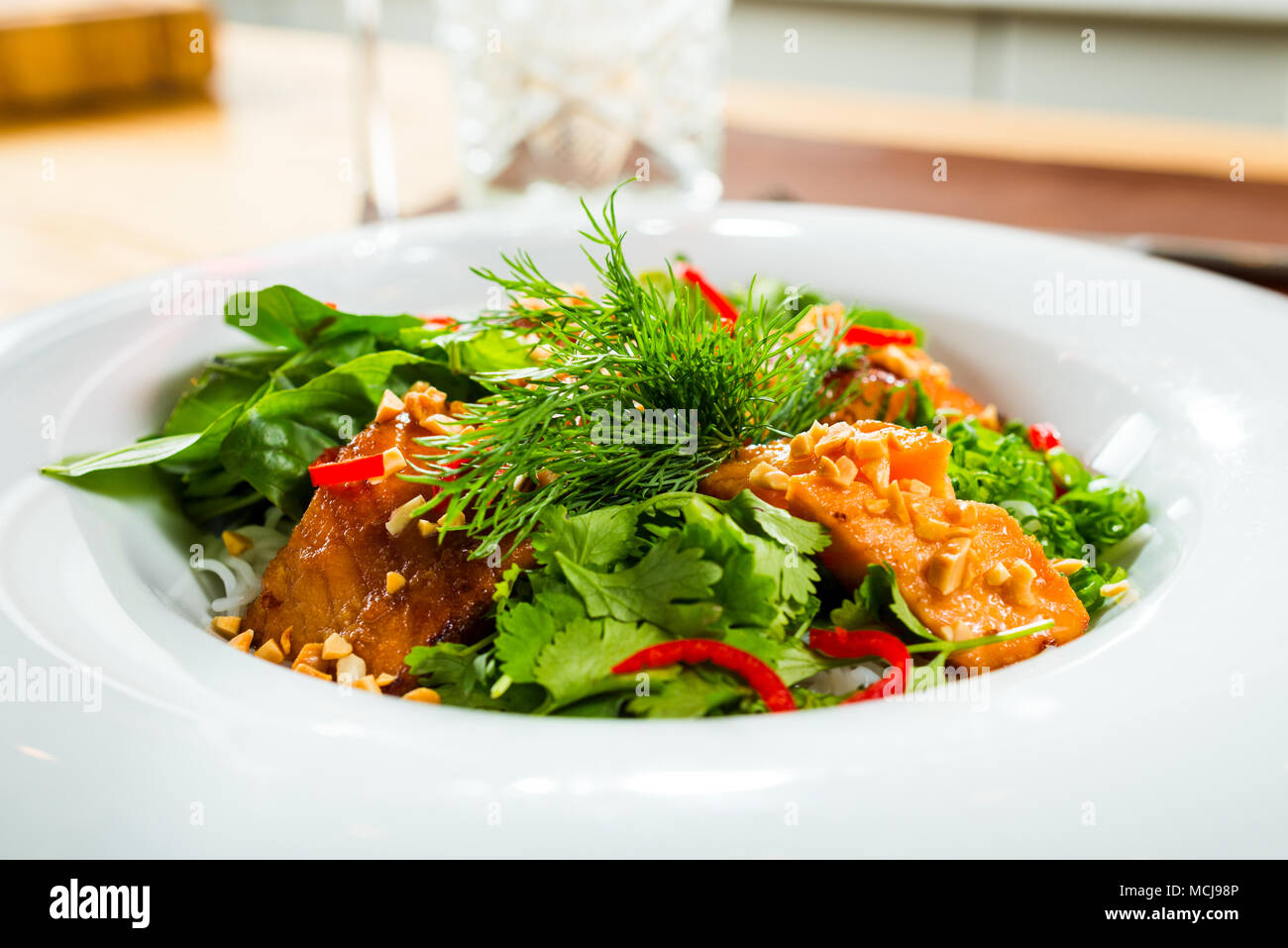 Fish salad dressed with sauce Stock Photo