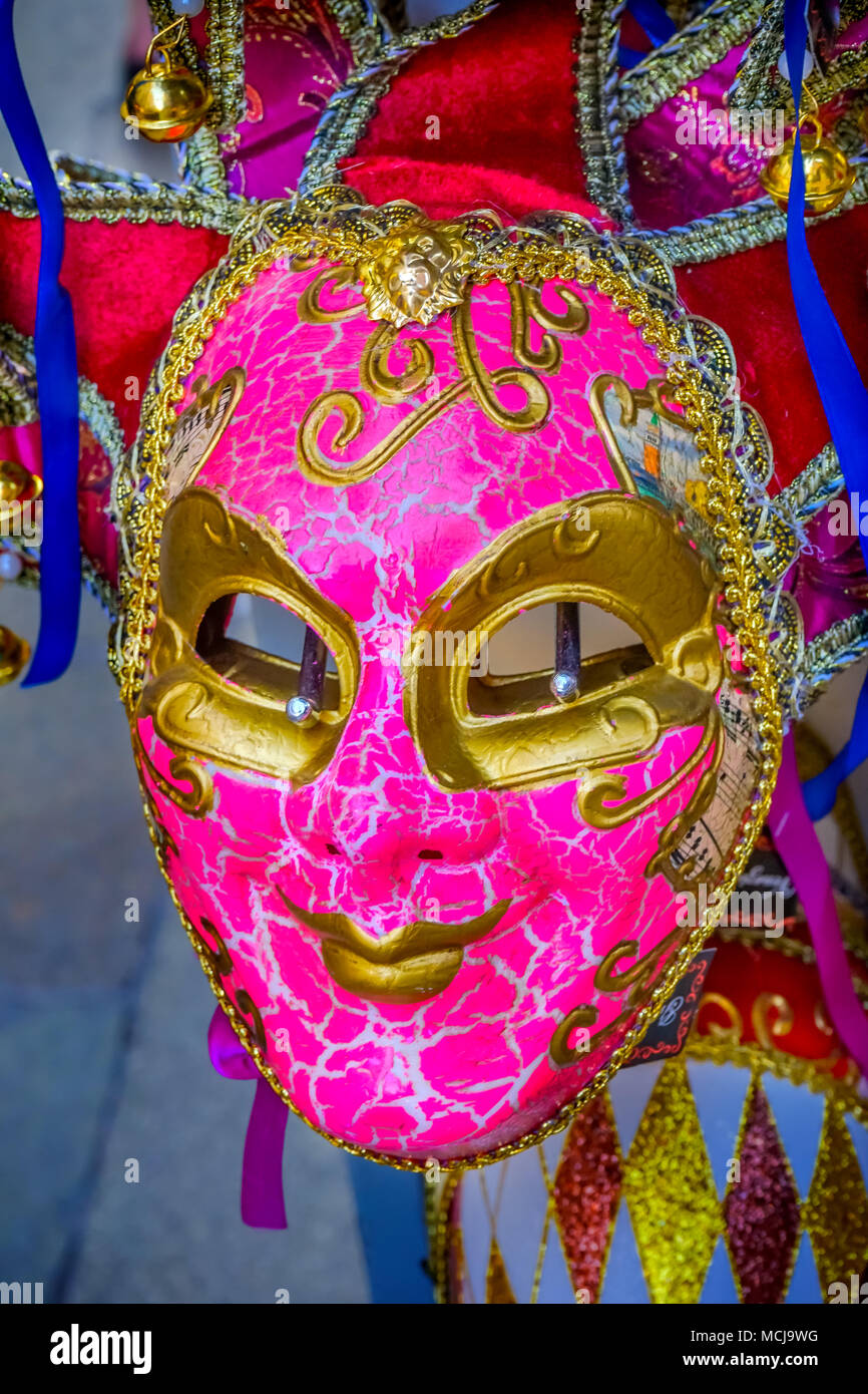 Pink Venetian Mask Venice Italy Used since the 1200s for Carnival, which were celebrated just before Lent.  In ancient times, Masks allowed the Veneti Stock Photo