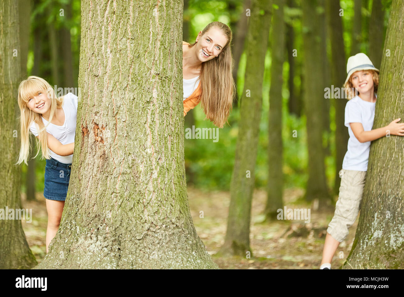 Playing hide and seek with kids hi-res stock photography and