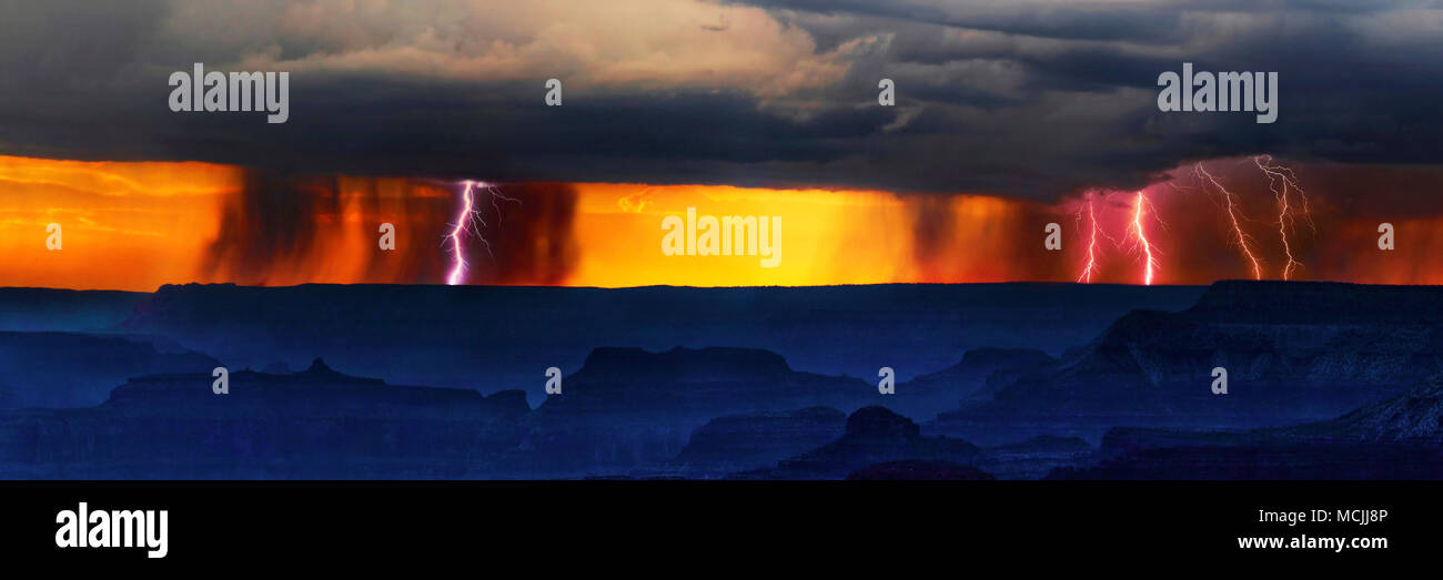 Panorama, Dark thunderclouds with lightning over Grand Canyon at sunset, in front viewpoint Mather Point, South Rim Stock Photo