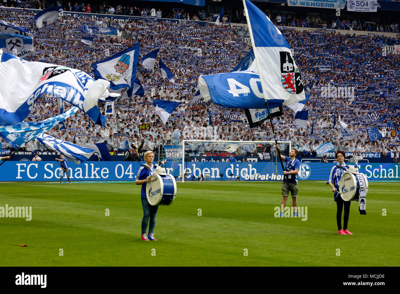 sports, football, Bundesliga, 2017/2018, FC Schalke 04 vs BVB Borussia Dortmund 2:0, Veltins Arena Gelsenkirchen, fun and enthusiasm at the football fans, flag waving, flag bearers Stock Photo