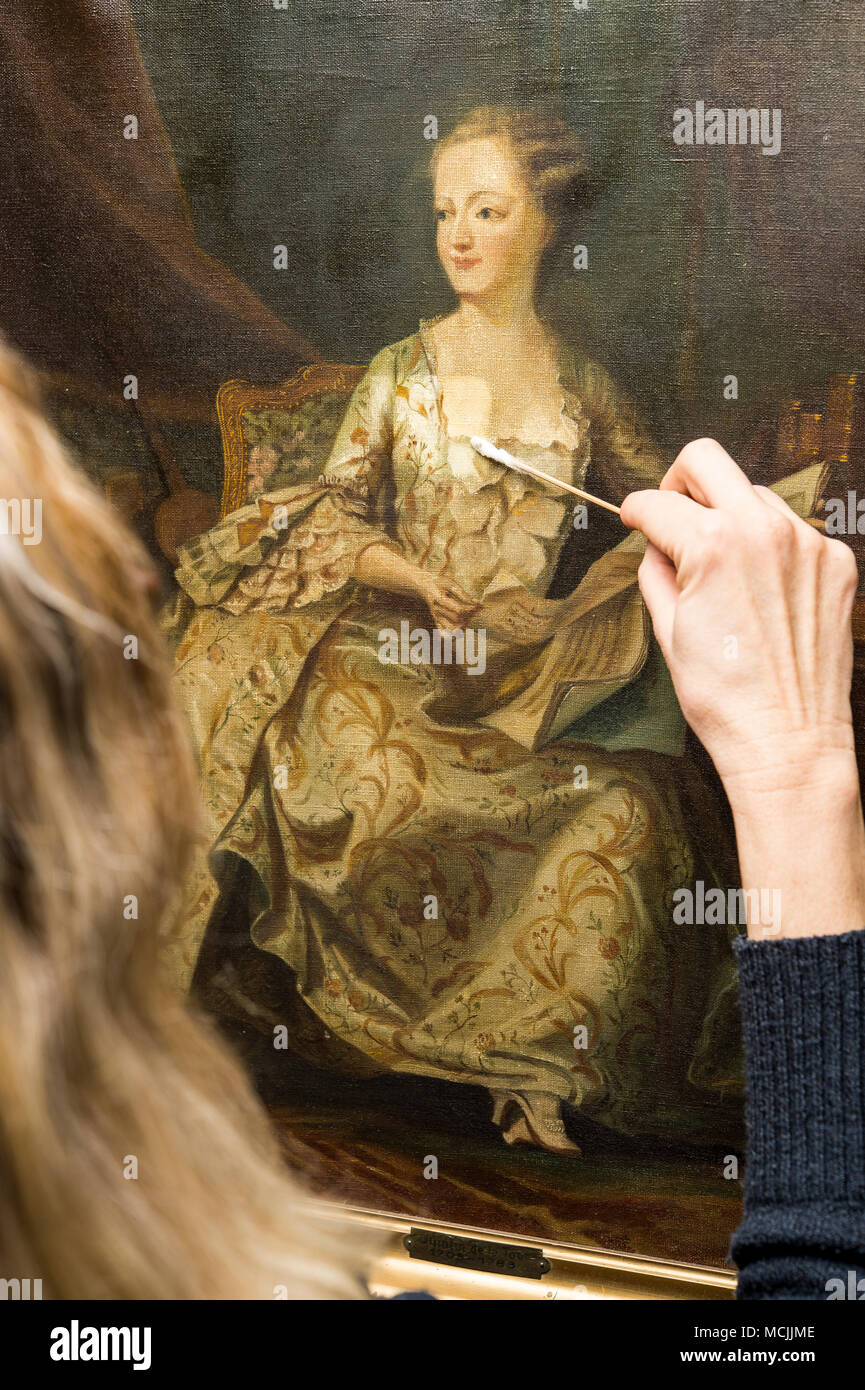 Restoration studio, restorer, woman cleans a painting with cotton swabs, Munich, Bavaria, Germany Stock Photo