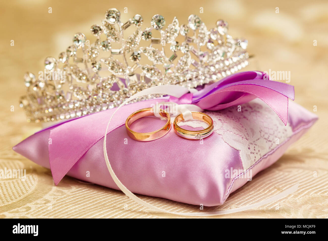Golden Wedding Rings On The Purple Lace Pillow Closeup Marriage