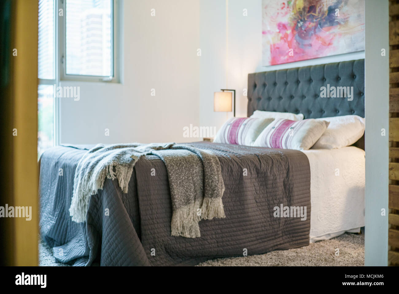 Interior of cozy bedroom in modern design Stock Photo - Alamy